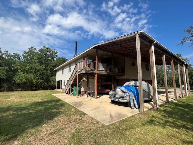 34062 Laurent Rd, Slidell, LA 70460 - view of vehicle parking with a carport and stairs