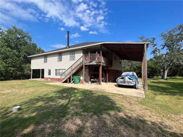 34062 Laurent Rd, Slidell, LA 70460 - back of house featuring a lawn, stairs, and driveway