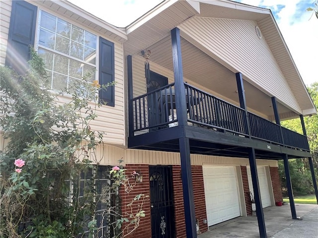 34062 Laurent Rd, Slidell, LA 70460 - view of side of property with a garage and a balcony