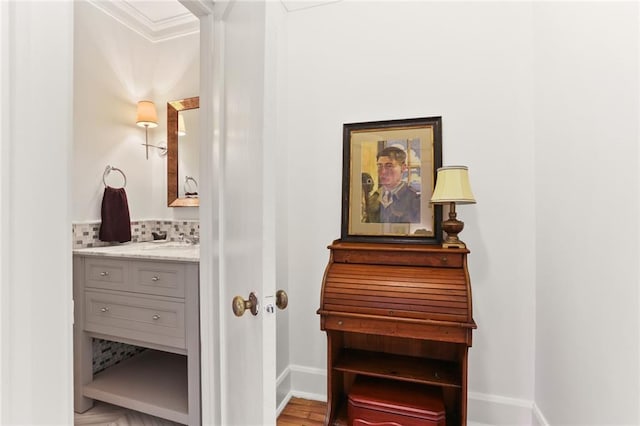 303 Audubon St, New Orleans, LA 70118 - hallway with baseboards, ornamental molding, and light wood-style floors
