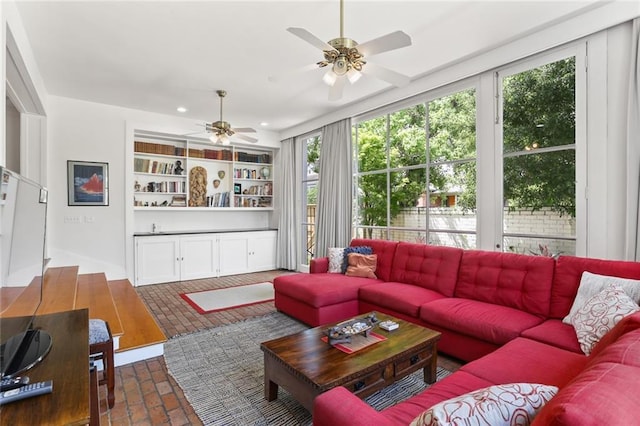 303 Audubon St, New Orleans, LA 70118 - living area with brick flooring, ceiling fan, plenty of natural light, and recessed lighting