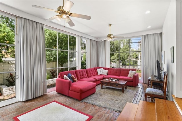 303 Audubon St, New Orleans, LA 70118 - living area featuring brick flooring, ceiling fan, plenty of natural light, and recessed lighting