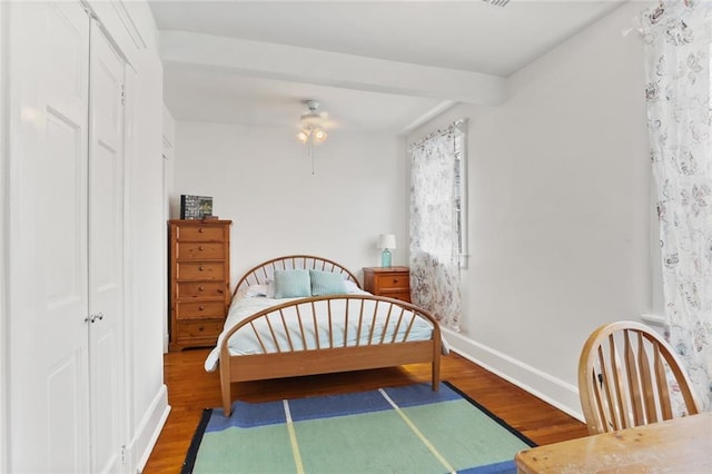 303 Audubon St, New Orleans, LA 70118 - bedroom featuring wood finished floors, baseboards, and a closet