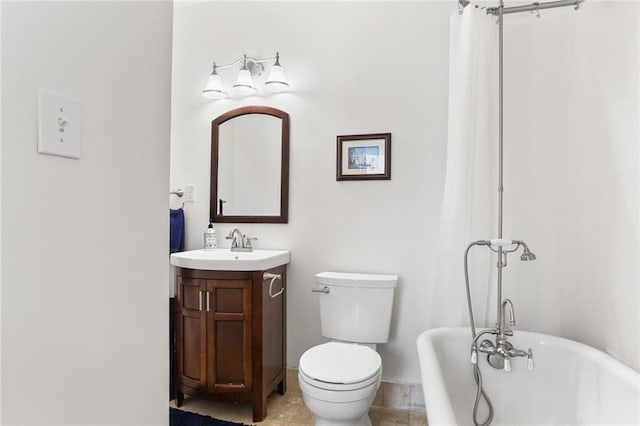 303 Audubon St, New Orleans, LA 70118 - bathroom featuring a freestanding bath, vanity, and toilet