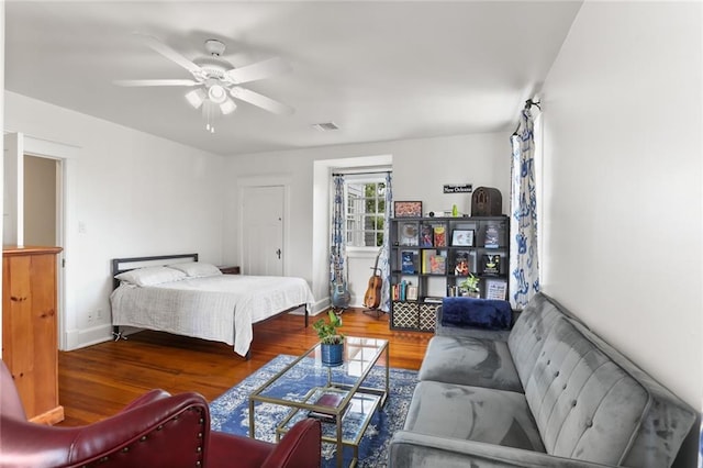 303 Audubon St, New Orleans, LA 70118 - bedroom featuring wood finished floors, baseboards, and a ceiling fan