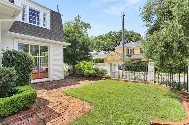 303 Audubon St, New Orleans, LA 70118 - view of yard featuring a patio