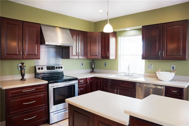 115 Silverwood Dr, Slidell, LA 70461 - kitchen featuring a sink, light countertops, wall chimney range hood, and appliances with stainless steel finishes