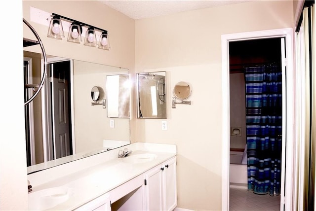 115 Silverwood Dr, Slidell, LA 70461 - full bath featuring double vanity, shower / tub combo, a sink, and a textured ceiling
