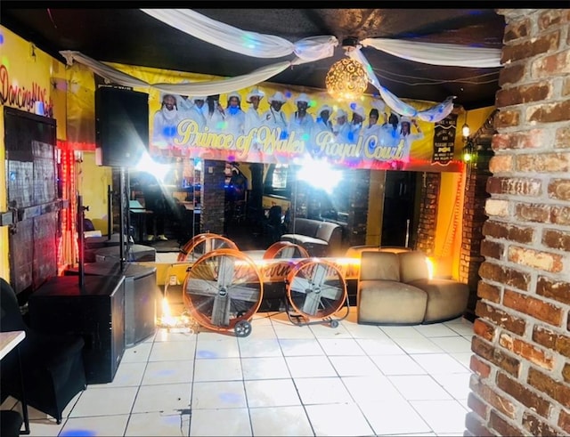 3801 Tchoupitoulas St, New Orleans, LA 70115 - playroom featuring tile patterned floors and brick wall