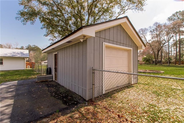 view of outbuilding with fence and an outdoor structure