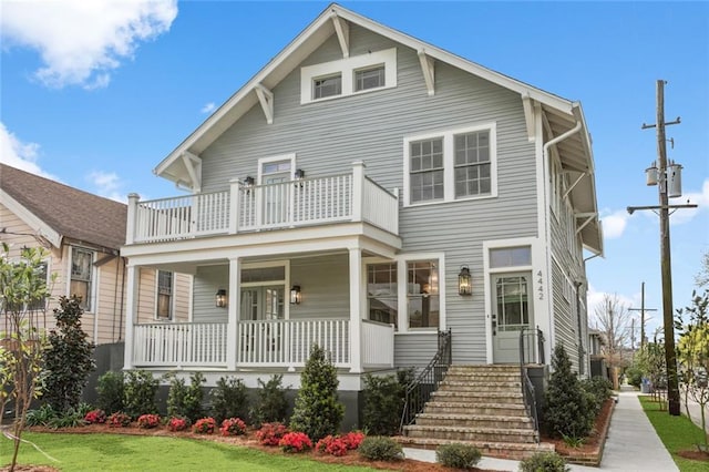 444244 S Johnson St, New Orleans, LA 70125 - view of front of property with a front yard, a balcony, and a porch