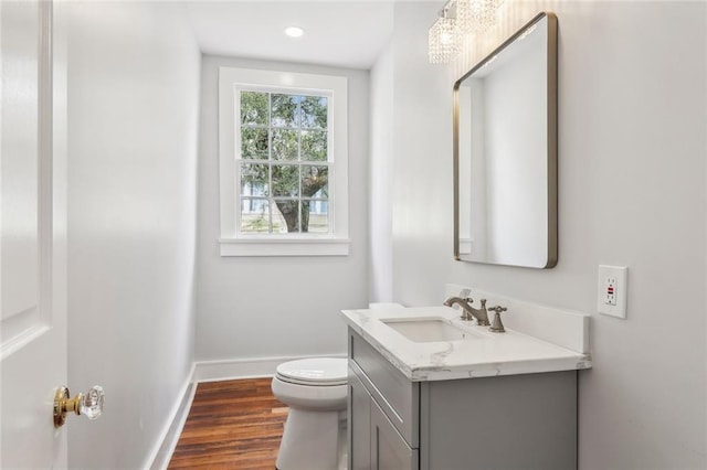 444244 S Johnson St, New Orleans, LA 70125 - half bath with baseboards, wood finished floors, toilet, recessed lighting, and vanity