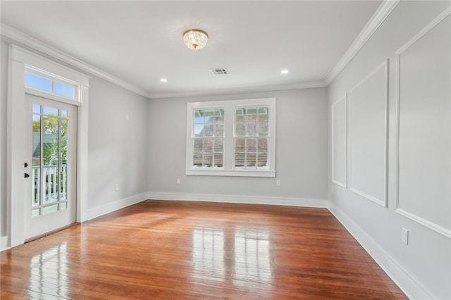 444244 S Johnson St, New Orleans, LA 70125 - spare room with crown molding, recessed lighting, baseboards, visible vents, and wood finished floors