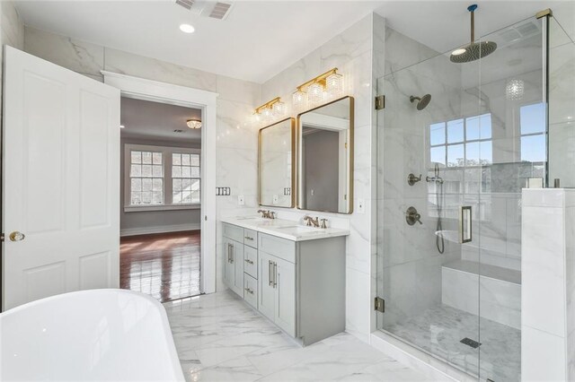 444244 S Johnson St, New Orleans, LA 70125 - bathroom featuring a freestanding tub, a stall shower, marble finish floor, visible vents, and double vanity