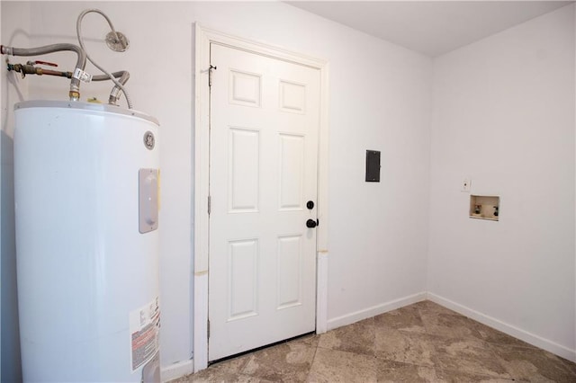laundry room with water heater, washer hookup, baseboards, and laundry area