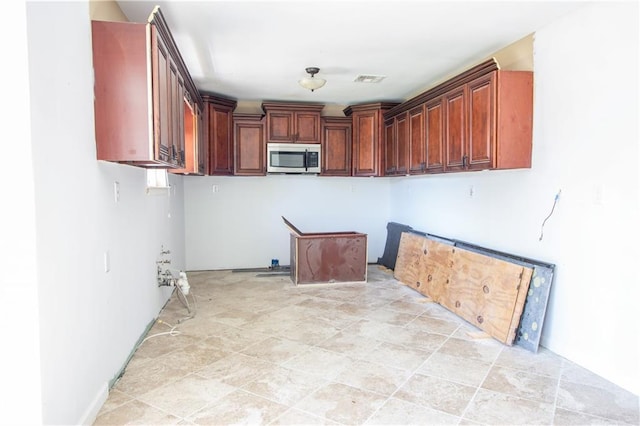 kitchen featuring stainless steel microwave
