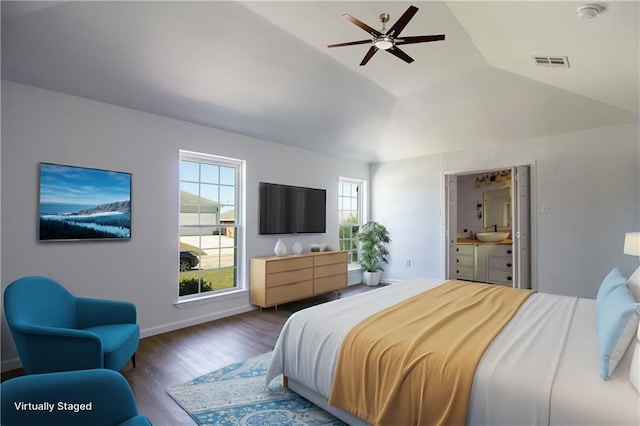 bedroom with vaulted ceiling, baseboards, a sink, visible vents, and wood finished floors