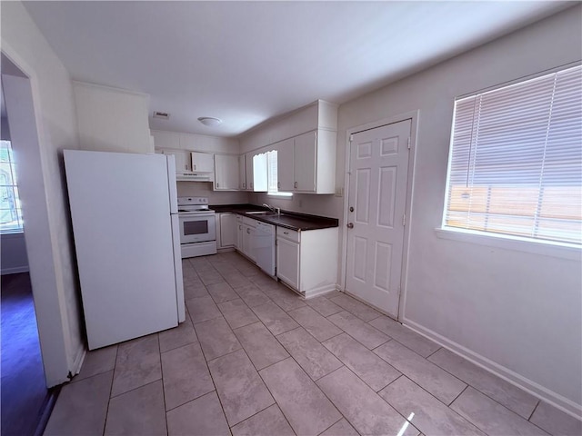 774-776 Holt Dr, Baton Rouge, LA 70815 - kitchen featuring white cabinets, white appliances, dark countertops, under cabinet range hood, and a sink