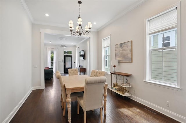 740 Florida Blvd, New Orleans, LA 70124 - dining room featuring crown molding, a chandelier, baseboards, dark wood finished floors, and ceiling fan