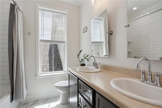 740 Florida Blvd, New Orleans, LA 70124 - full bathroom featuring toilet, marble finish flooring, double vanity, healthy amount of natural light, and recessed lighting