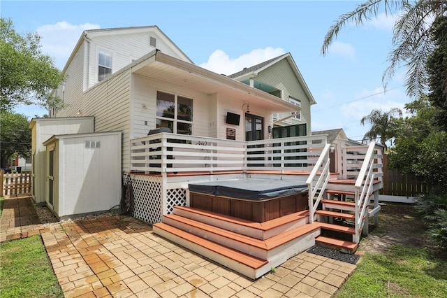 740 Florida Blvd, New Orleans, LA 70124 - rear view of house featuring a hot tub, a wooden deck, and a patio