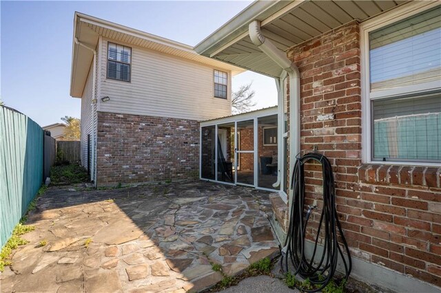 4012 Berot St, Metairie, LA 70002 - fenced backyard with a sunroom and a patio area