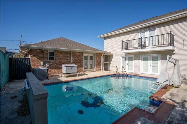 4012 Berot St, Metairie, LA 70002 - view of swimming pool with french doors, central AC, a fenced backyard, and a patio area