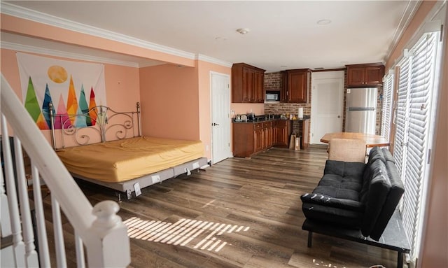 4012 Berot St, Metairie, LA 70002 - bedroom featuring freestanding refrigerator, dark wood-style floors, and ornamental molding