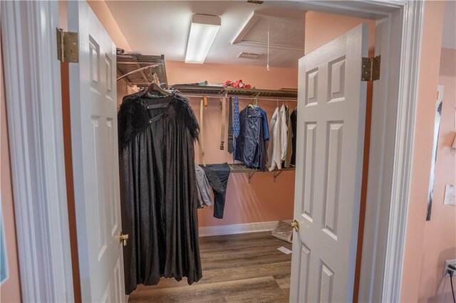 4012 Berot St, Metairie, LA 70002 - spacious closet featuring attic access and wood finished floors