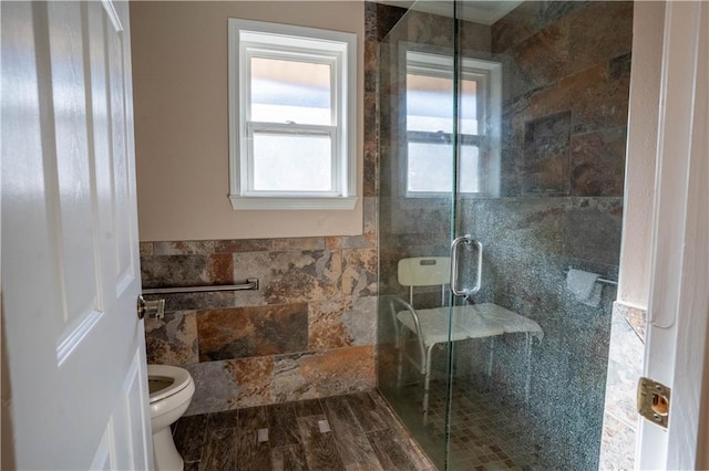 4012 Berot St, Metairie, LA 70002 - full bathroom featuring a shower stall, toilet, and tile walls