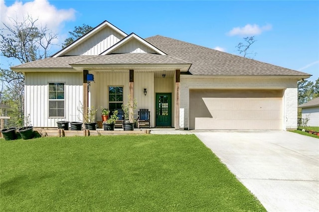 31527 Meadow Lark Ln, Denham Springs, LA 70726 - view of front facade with a front lawn, a shingled roof, a garage, driveway, and board and batten siding