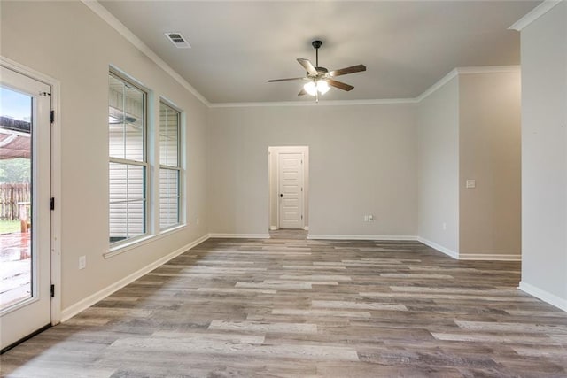 31527 Meadow Lark Ln, Denham Springs, LA 70726 - spare room featuring wood finished floors, ceiling fan, ornamental molding, and baseboards