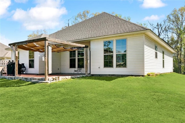 31527 Meadow Lark Ln, Denham Springs, LA 70726 - back of property featuring a lawn, a patio, and roof with shingles