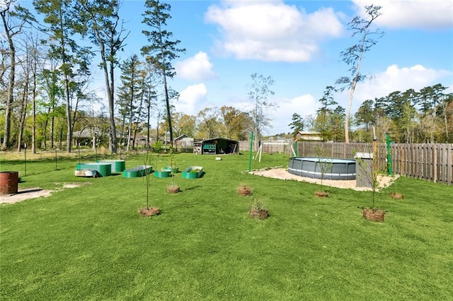 31527 Meadow Lark Ln, Denham Springs, LA 70726 - view of home's community featuring a pool, fence, and a lawn