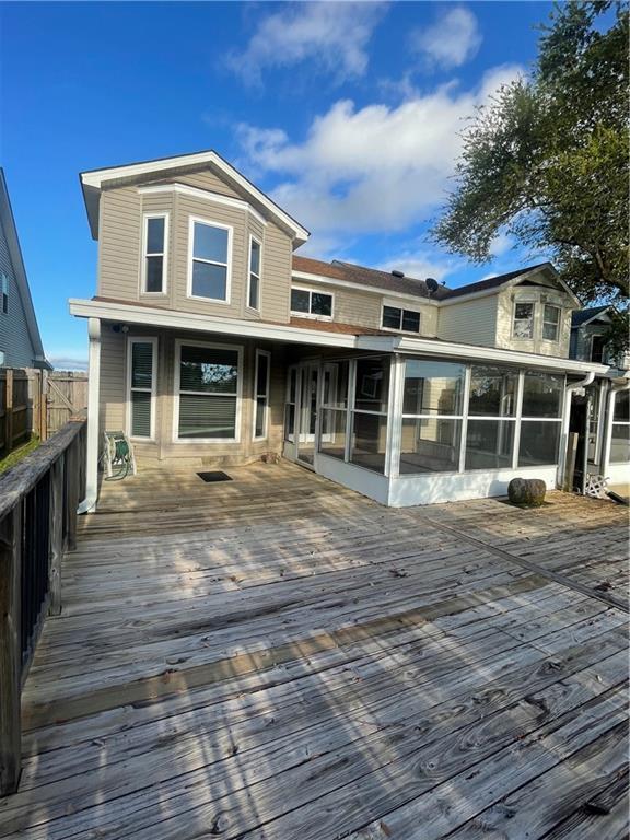 416 Marina Dr, Slidell, LA 70458 - exterior space with a sunroom, fence, and a wooden deck
