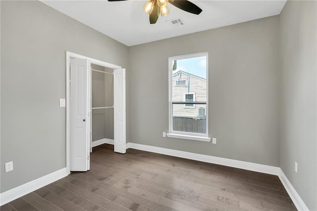 8820 Cohn St, New Orleans, LA 70118 - unfurnished bedroom featuring baseboards, a closet, visible vents, and dark wood-type flooring