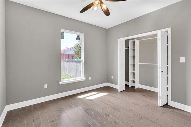 8820 Cohn St, New Orleans, LA 70118 - unfurnished bedroom featuring a ceiling fan, baseboards, and wood finished floors