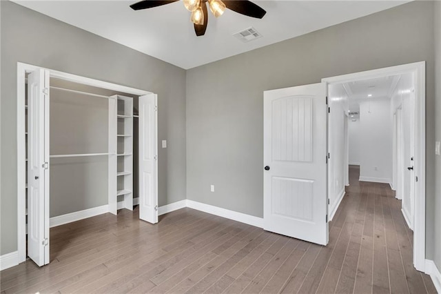 8820 Cohn St, New Orleans, LA 70118 - unfurnished bedroom featuring a ceiling fan, wood finished floors, baseboards, and visible vents