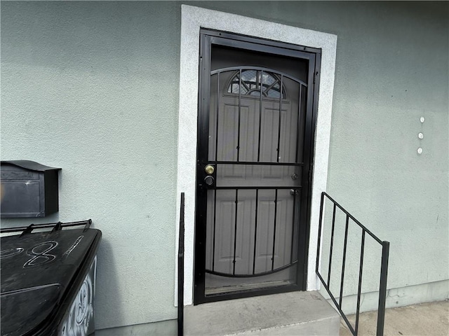 1827 S Rampart St, New Orleans, LA 70113 - doorway to property featuring stucco siding