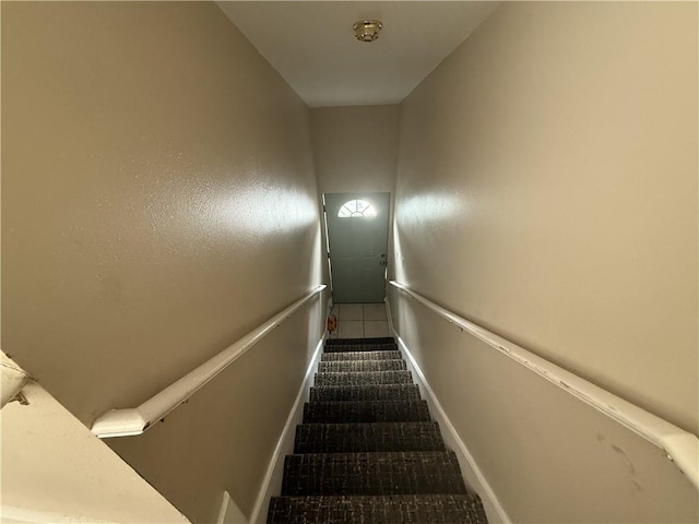 1827 S Rampart St, New Orleans, LA 70113 - stairs featuring baseboards and carpet flooring