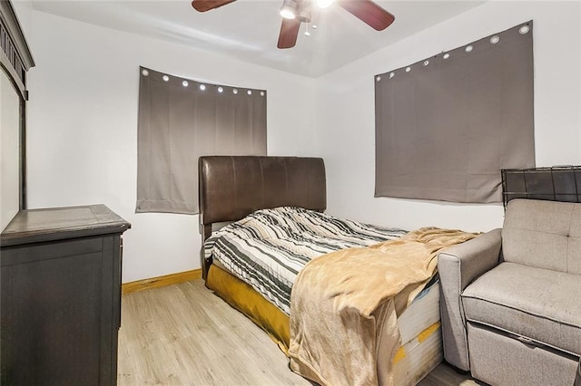 3020 Decomine Dr, Chalmette, LA 70043 - bedroom with light wood-type flooring, baseboards, and ceiling fan
