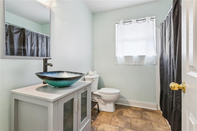 3020 Decomine Dr, Chalmette, LA 70043 - bathroom featuring toilet, vanity, and baseboards