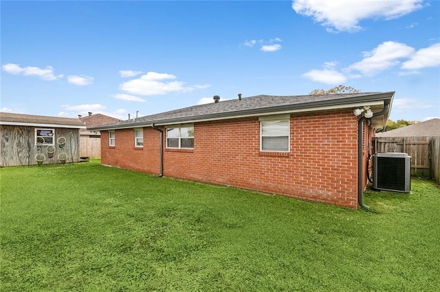 3020 Decomine Dr, Chalmette, LA 70043 - back of property with central AC unit, an outbuilding, brick siding, and a storage shed