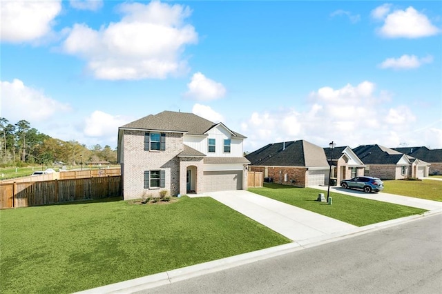 traditional home with a garage, fence, a front lawn, brick siding, and concrete driveway