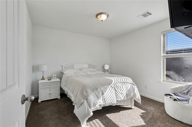 bedroom featuring carpet flooring, visible vents, and baseboards