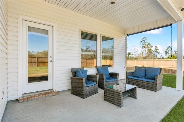 view of patio / terrace with outdoor lounge area and fence