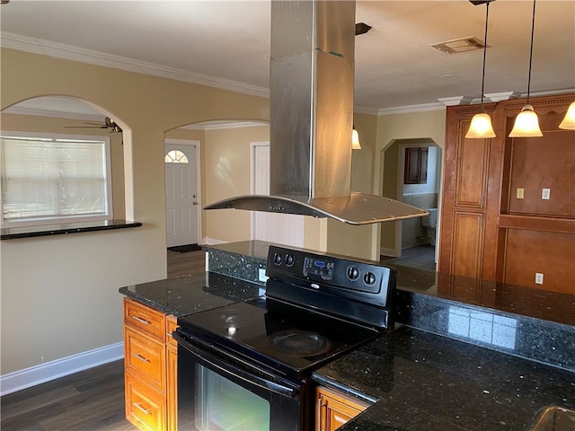 1569 Athis St, New Orleans, LA 70122 - kitchen featuring electric range, arched walkways, crown molding, and brown cabinetry