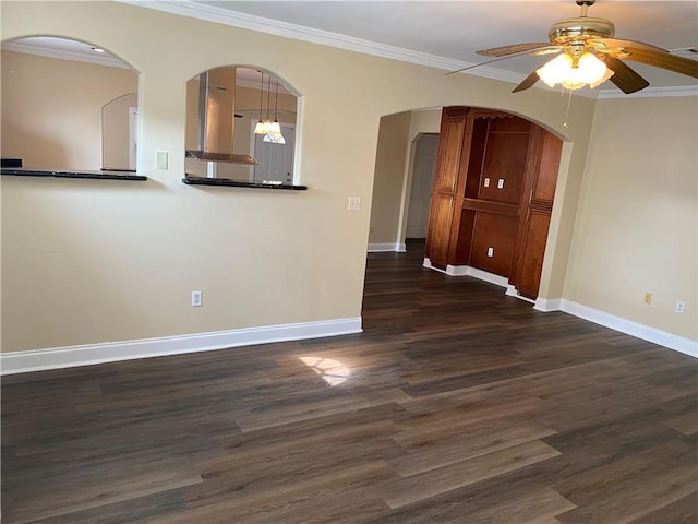 1569 Athis St, New Orleans, LA 70122 - spare room with a ceiling fan, dark wood-style floors, arched walkways, and crown molding