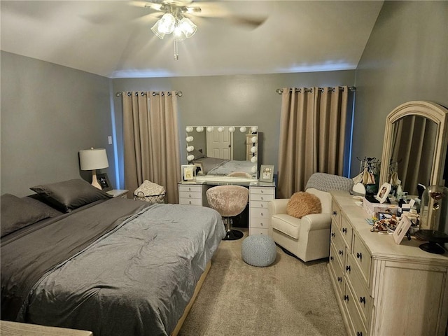 bedroom with light colored carpet and a ceiling fan