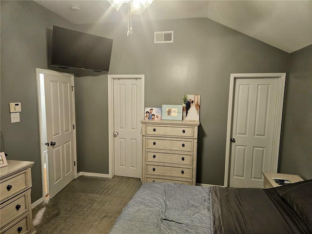 bedroom with visible vents, baseboards, and vaulted ceiling